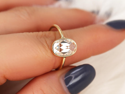 oval rose cut ring on pointer and thumb finger in yellow gold