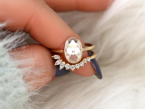 moissanite rose cut ring in oval cut paired with unique curved diamond band on finger
