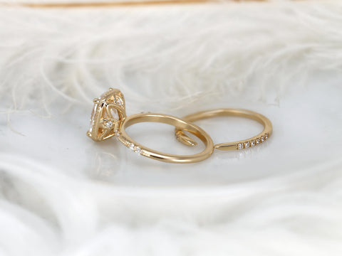 antique cushion button back ring with milgrain edge paired with a open diamond band with pointed opening on white background from behind