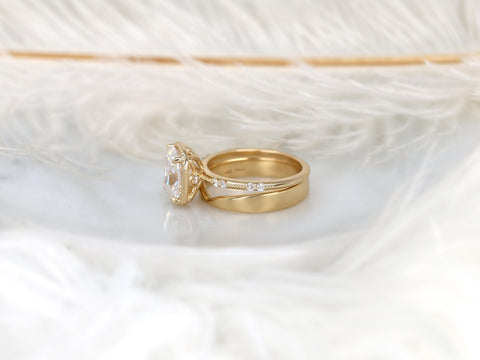 antique cushion solitaire with button back, claw prongs, and diamond accents on band. the ring is paired with a chevron solid gold band on white background side view