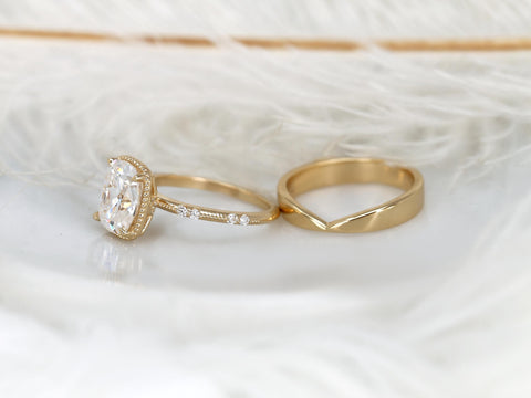 antique cushion solitaire with button back, claw prongs, and diamond accents on band. the ring is paired with a chevron solid gold band on white background 3/4 angled