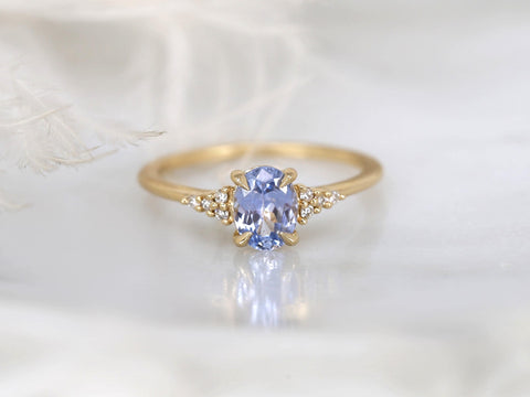 oval cornflower lilac sapphire cluster ring with dainty diamonds front view white background