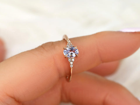 oval cluster sapphire ring with lavender sapphire in rose gold on pointer finger
