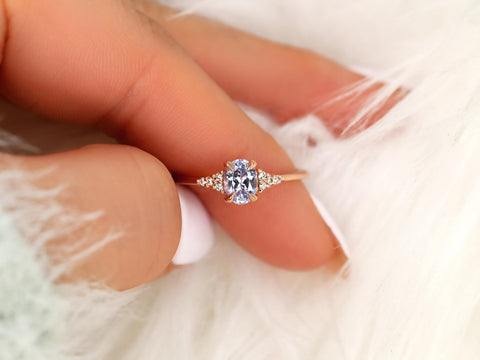 oval cluster sapphire ring with lavender sapphire on pointer between thumb