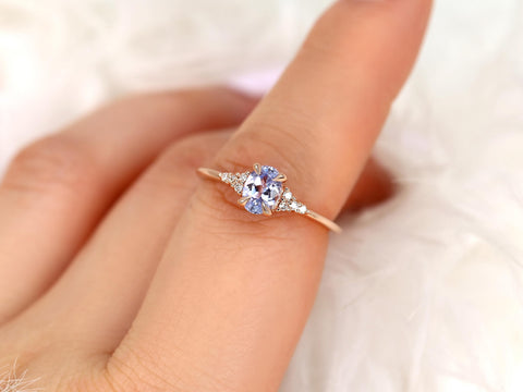 oval cluster sapphire ring with lavender sapphire in rose gold on pointer  finger
