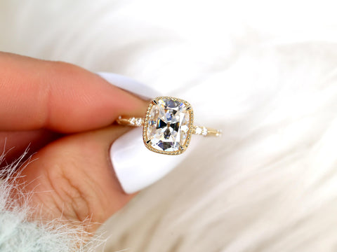 antique cut cushion button back solitaire with diamond accents front view between finger on white background