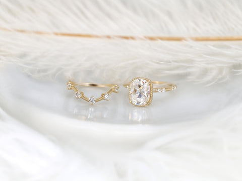 antique cushion engagement ring with button back paired with a curved diamond spaced band shown on white background