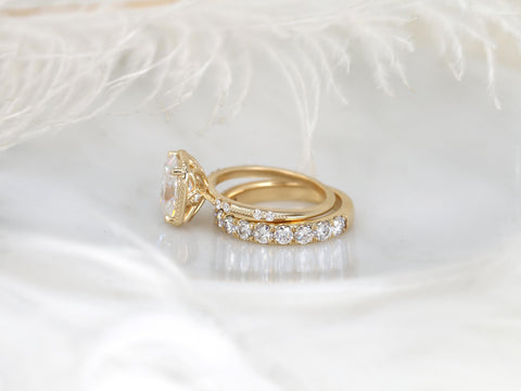 antique cushion cut button back ring with accent diamonds paired with a thick diamond band shown on side on white background
