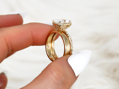 antique cushion solitaire with button back, claw prongs, and diamond accents on band. the ring is paired with a chevron solid gold band gallery profile