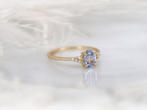 oval cornflower lilac sapphire cluster ring with dainty diamonds side view white background