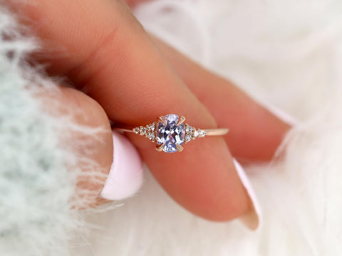 oval cluster sapphire ring with lavender sapphire in rose gold pointer finger and thumb