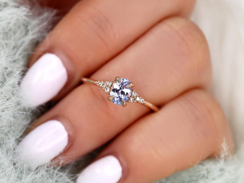 oval cluster sapphire ring with lavender sapphire in rose gold ring finger