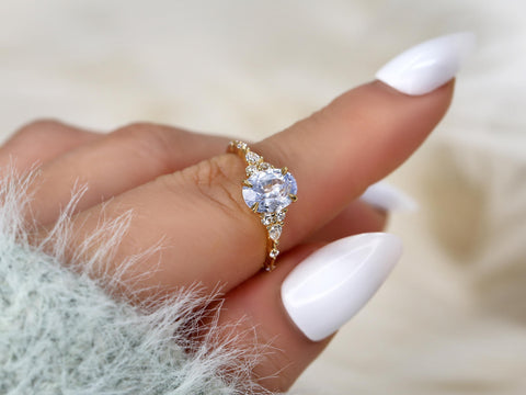 frosted lavender cornflower sapphire oval cluster ring in 14kt gold on finger