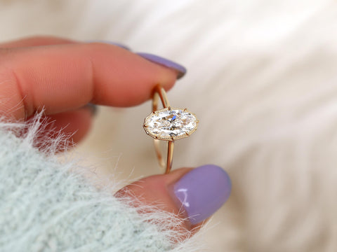 moval diamond button back ring with milgrain in halo and plain shank and lucida gallery between fingers