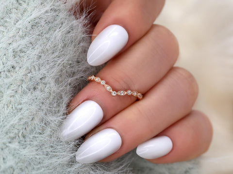 chevron dainty diamond band with vintage detail on middle finger in rose gold