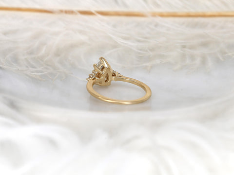 pear cluster ring with yellow gold on white background with feathers back view