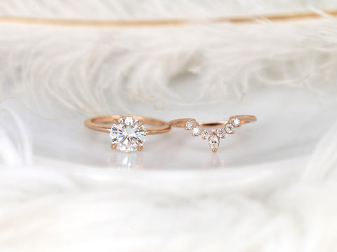 round engagement wedding ring set in rose gold with a complimentary unique curved ring on white background separated