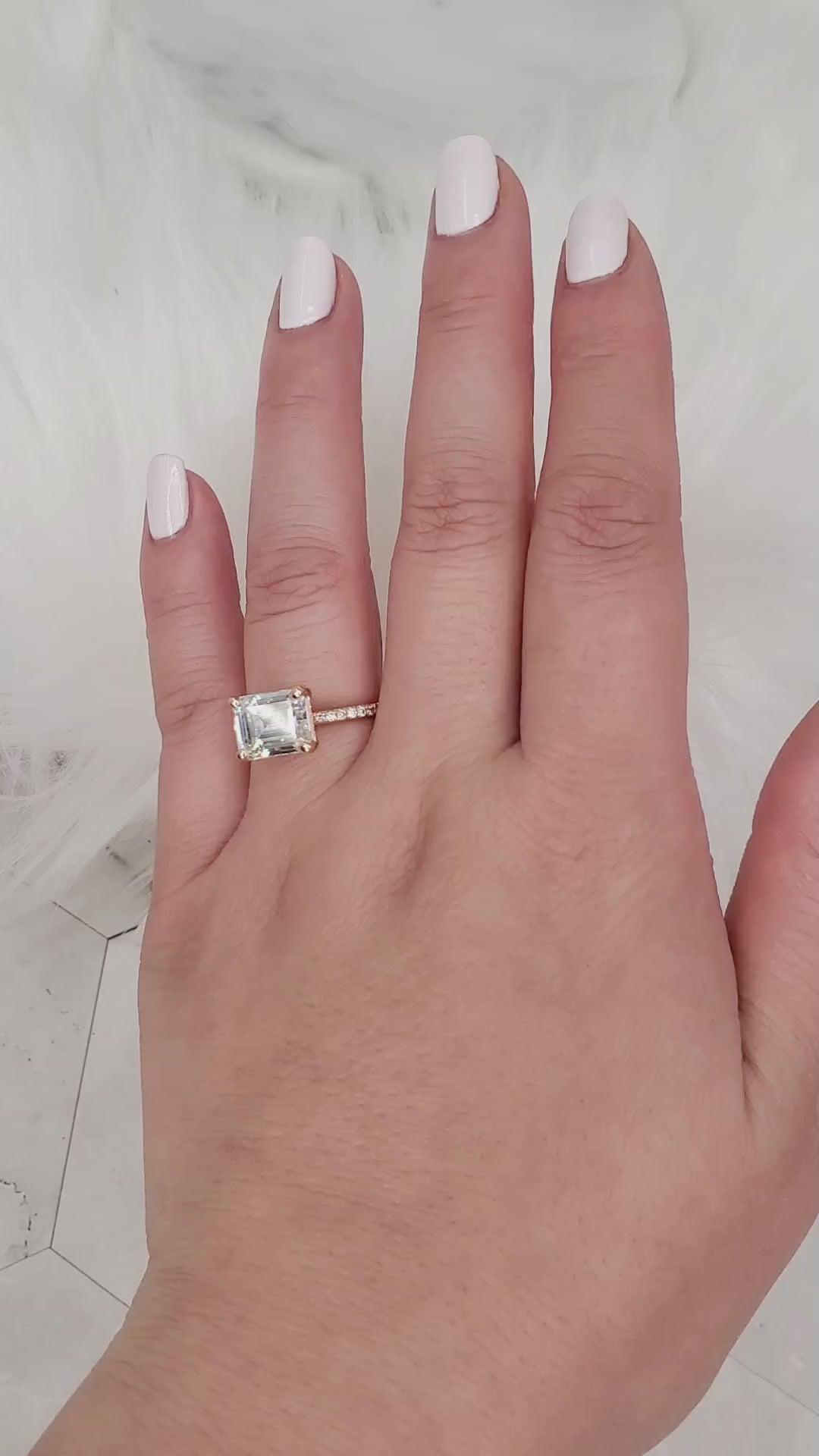 east west set emerald cut solitaire with diamonds on band on video